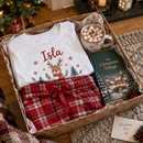 Personalised Christmas pyjamas with the name Isla in a Christmas Eve box