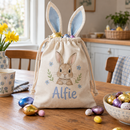 Personalised Easter basket bag with the name Alfie filled with eggs on a kitchen table