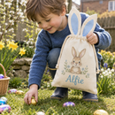 Personalised Easter basket bag with the name Alfie held by a child on an egg hunt