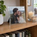 Personalised glass photo frame, a square 20x20cm frame on a bookshelf next to candles