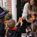 Halloween treat boxes with the name Ava's Party handed out at the front door