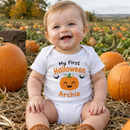 My first Halloween baby grow with the name Archie worn by a baby in a pumpkin patch