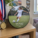 Personalised award plaque, displayed on a teenage girl's bedroom shelf next to medals
