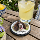 Personalised slate photo coaster, with a glass of lemonade on it on a garden table in summer