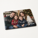 Personalised photo placemat printed with a family Christmas photo and the name Grace, on a plain background
