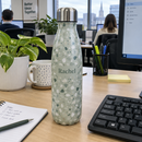 Patterned drinks bottle on an office desk