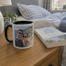 Photo latte mug with black inside on a bedside table