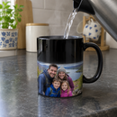 Black magic mug revealing a family photo as hot water is poured