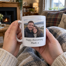 Revealed photo mug held on the sofa