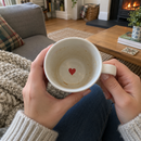 Red heart hidden inside the bottom of the mug