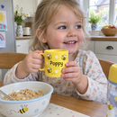 Yellow name mug for a toddler at breakfast