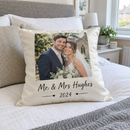 Wedding photo cushion on a bed