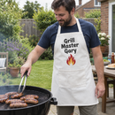 Man in a name apron at a garden barbecue