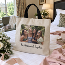 Bridesmaid photo tote bag on a hotel bed