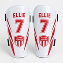 Custom kids' football shin pads in white printed with name, number and team badge