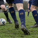 Sunday league players wearing matching personalised football socks with team name