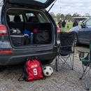 Personalised drawstring kit bag in a family car boot on matchday
