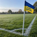 Custom football corner flag with team name at the corner of a grassroots pitch