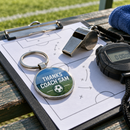 Personalised coach keyring on a clipboard with a whistle and stopwatch