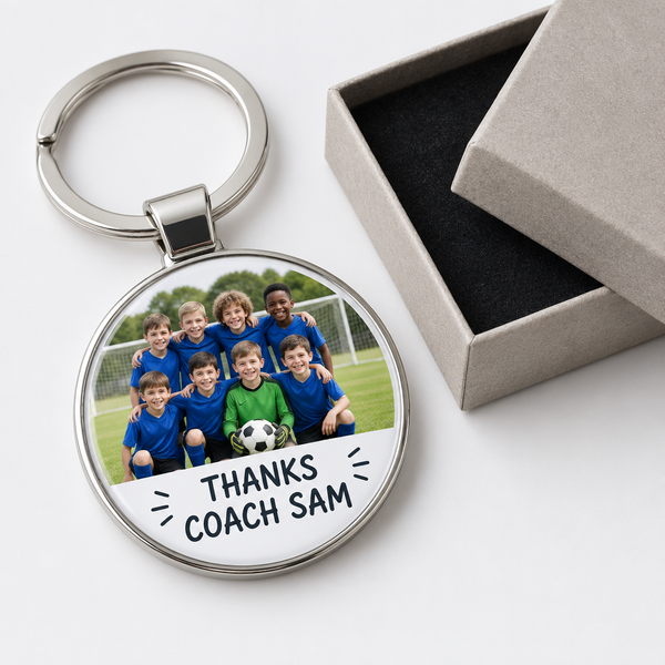 Personalised football coach keyring with team photo and thank you message beside its gift box