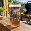 Pint glass with a colour photo of two mates on a garden bar