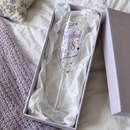 Lilac and silver printed flute in an open gift box