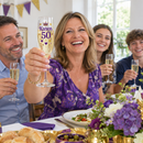 Purple and gold Karen 50 flute raised at a family birthday lunch