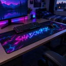 Neon gamer tag desk mat under a keyboard and mouse in a bedroom gaming set-up