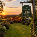 Garden bar at sunset with a hanging pub sign reading 'The Shed Inn, Est. 2022'