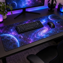 Galaxy desk mat under a keyboard and mouse on an RGB gaming desk