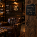 Man cave with a dartboard and a landlord plaque reading 'The Garage Bar, Est. 2019'