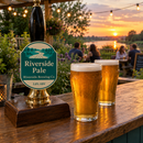Garden bar at sunset with a teal pump clip for 'Riverside Pale' by Riverside Brewing Co