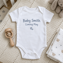 Lifestyle photo of the pregnancy announcement baby grow in a UK home