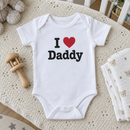 Lifestyle photo of the I heart Daddy baby grow in a UK home