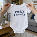 Lifestyle photo of the Daddy's favourite baby grow in a UK home