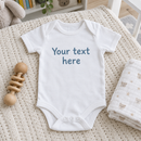 Lifestyle photo of the custom text baby grow in a UK home