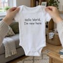 Lifestyle photo of the personalised message baby grow in a UK home