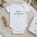 Lifestyle photo of the baby coming soon baby grow in a UK home