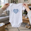 Lifestyle photo of the baby surname heart wings baby grow in a UK home