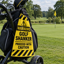 Funny golf shanker towel hanging from a golf bag beside the green