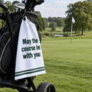 May the Course Be With You golf towel on a golf bag beside the green