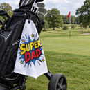Super Dad golf towel hanging from a golf bag on a UK course
