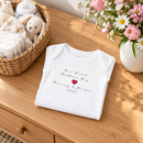Personalised first Mother's Day baby grow lifestyle photo with Our First Mother's Day Heart design in red, printed with baby's name