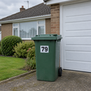 Personalised wheelie bin sticker on a green garden waste bin