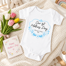 Personalised first Mother's Day baby grow lifestyle photo with Our 1st Mother's Day Flowers design in blue, printed with baby's name