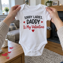 Lifestyle photo of the Sorry Ladies Daddy Is My Valentine baby grow in a UK home