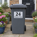 Personalised wheelie bin sticker on a grey bin by a front path