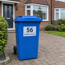 Personalised wheelie bin sticker on a blue recycling bin on a drive