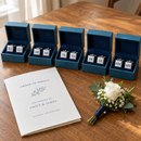 Gift-boxed cufflinks for the best man and ushers, each printed with their initials