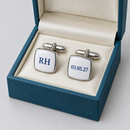 Curved square chrome cufflinks printed with initials and a date in a gift box
